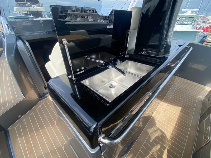 Slide: The Image of 2024 Solaris Power 40F open yacht with sleek outdoor kitchen and stainless steel sink. - 31