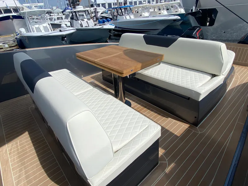 Slide: The Image of 2024 Solaris Power 40F Open yacht with elegant seating and wooden table on deck. - 38