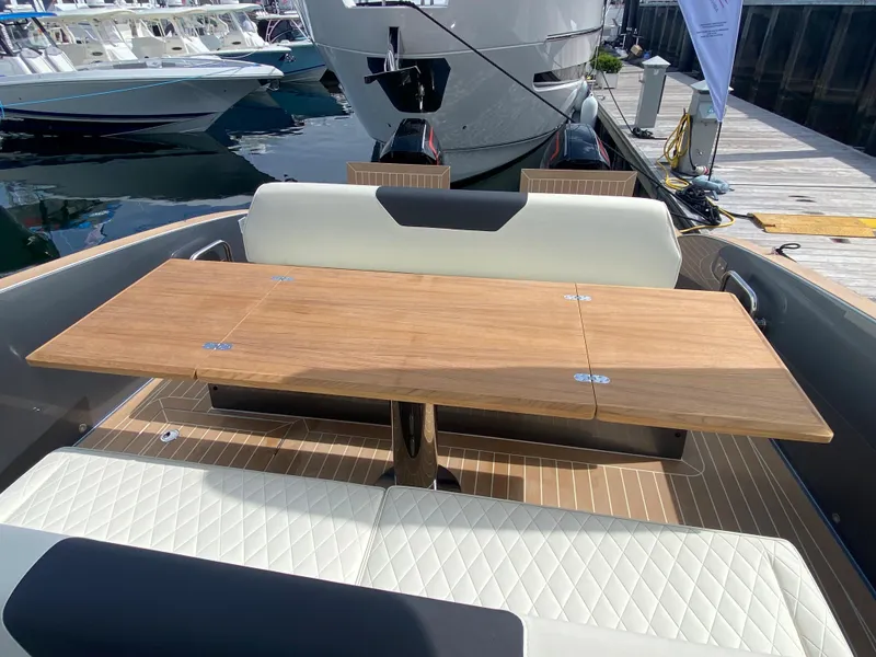 Slide: The Image of 2024 Solaris Power 40F Open yacht with elegant wooden table and seating area. - 39