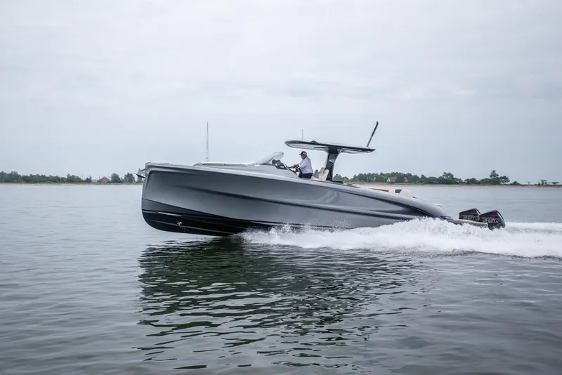 Slide: The Image of 2024 Solaris Power 40F Open yacht cruising on calm waters. - 4