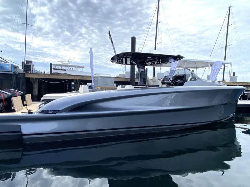 Slide: The Image of 2024 Solaris Power 40F Open yacht docked, showcasing sleek design and modern features. - 6