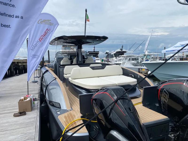 Slide: The Image of 2024 Solaris Power 40F Open yacht docked, showcasing sleek design and luxurious seating. - 8