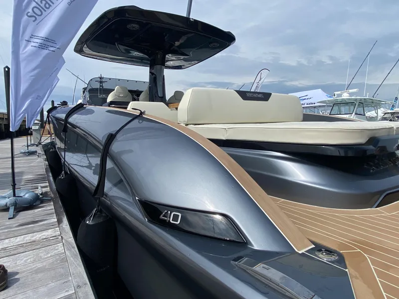 Slide: The Image of 2024 Solaris Power 40F Open luxury yacht docked, showcasing sleek design and modern features. - 9