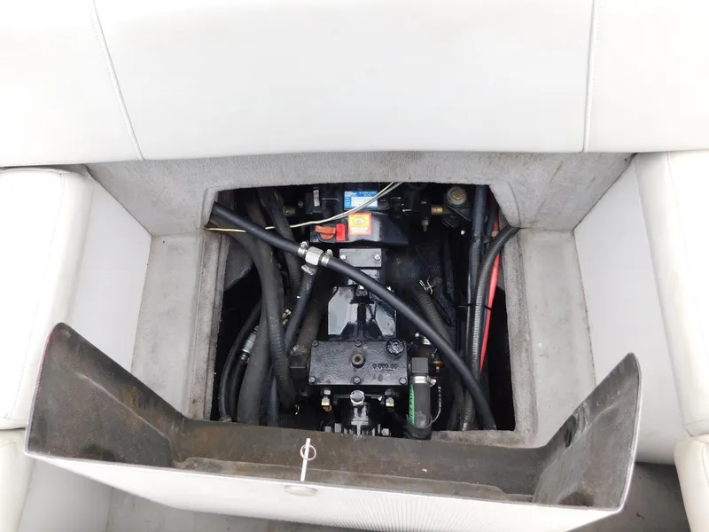Slide: The Image of Engine compartment of a 2004 Moomba 23XLV boat, showing hoses and components. - 20