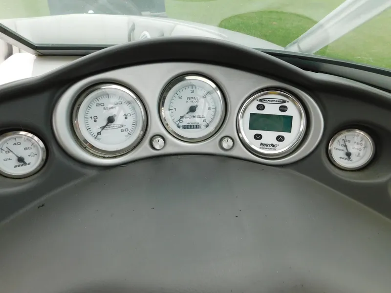 Slide: The Image of Dashboard of a 2004 Moomba 23XLV boat with gauges and controls. - 21