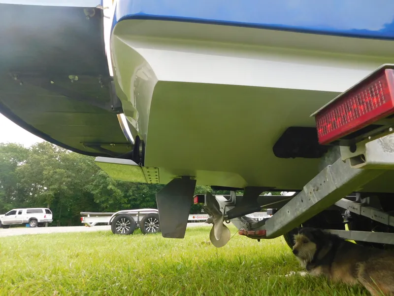 Slide: The Image of 2004 Moomba 23XLV boat on trailer, rear view, parked on grass. - 4