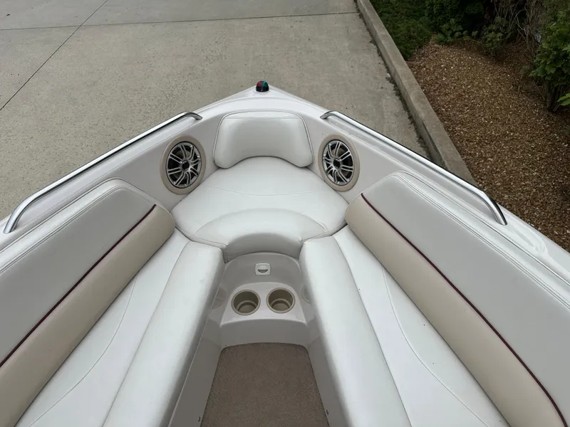 Slide: The Image of 1999 MasterCraft MariStar 210 VRS boat interior with white seating and cup holders. - 14