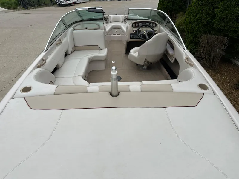Slide: The Image of 1999 MasterCraft MariStar 210 VRS boat interior with white seating and steering wheel. - 4