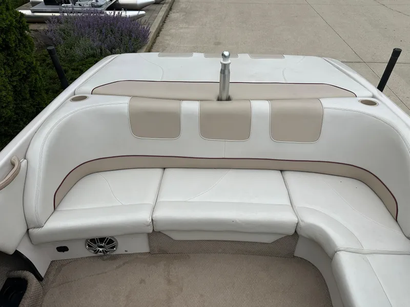 Slide: The Image of 1999 MasterCraft MariStar 210 VRS boat interior with white and beige seating. - 6