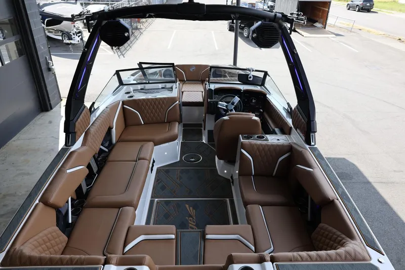 Slide: The Image of 2025 Tigé 24RZX boat interior with luxurious brown seating and modern design. - 11