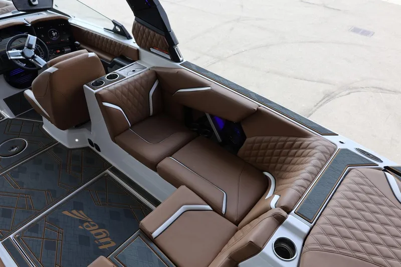 Slide: The Image of Luxurious interior of 2025 Tigé 24RZX boat with brown leather seating and modern design. - 13