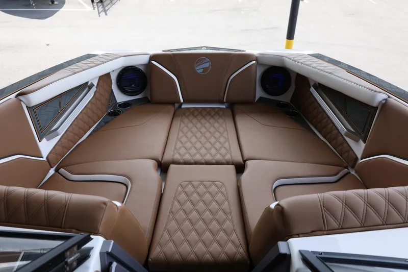 Slide: The Image of 2025 Tigé 24RZX boat interior with luxurious brown leather seating and modern design. - 15
