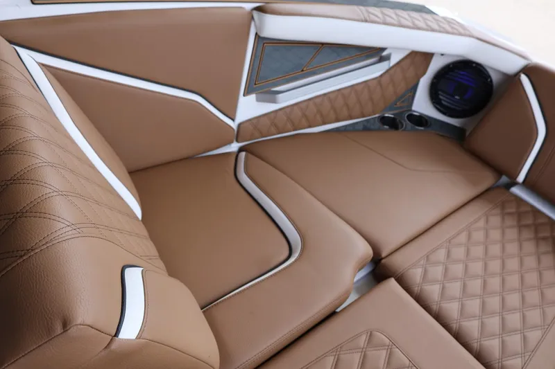Slide: The Image of Luxurious brown leather interior of 2025 Tigé 24RZX boat with quilted design. - 16