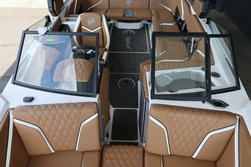 Slide: The Image of 2025 Tigé 24RZX boat interior with luxurious brown leather seating and modern design. - 23