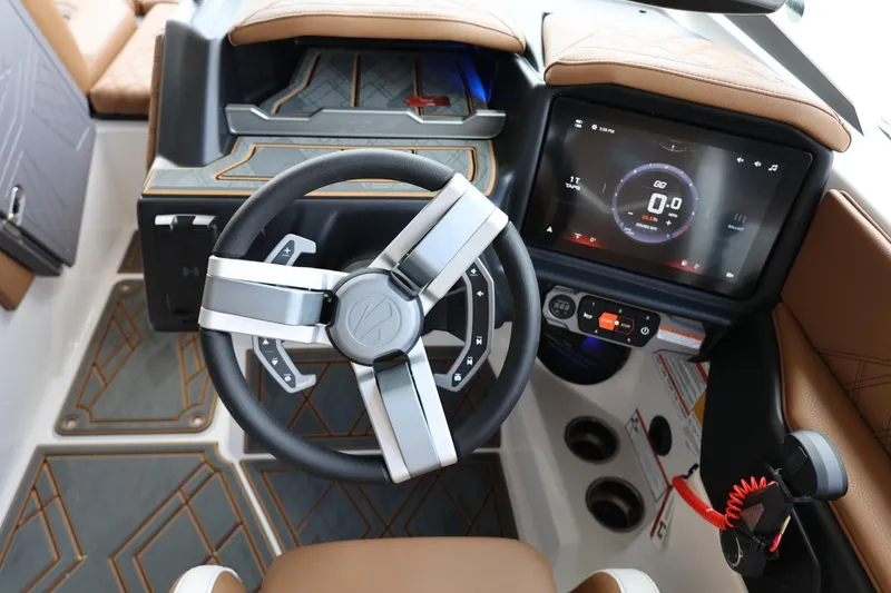 Slide: The Image of 2025 Tigé 24RZX boat interior with modern steering wheel and digital dashboard. - 27