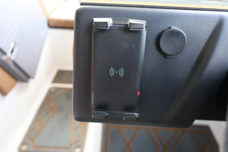 Slide: The Image of Dashboard of 2025 Tigé 24RZX with wireless charging pad. - 29