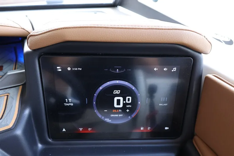 Slide: The Image of 2025 Tigé 24RZX dashboard display showing speedometer and controls. - 31