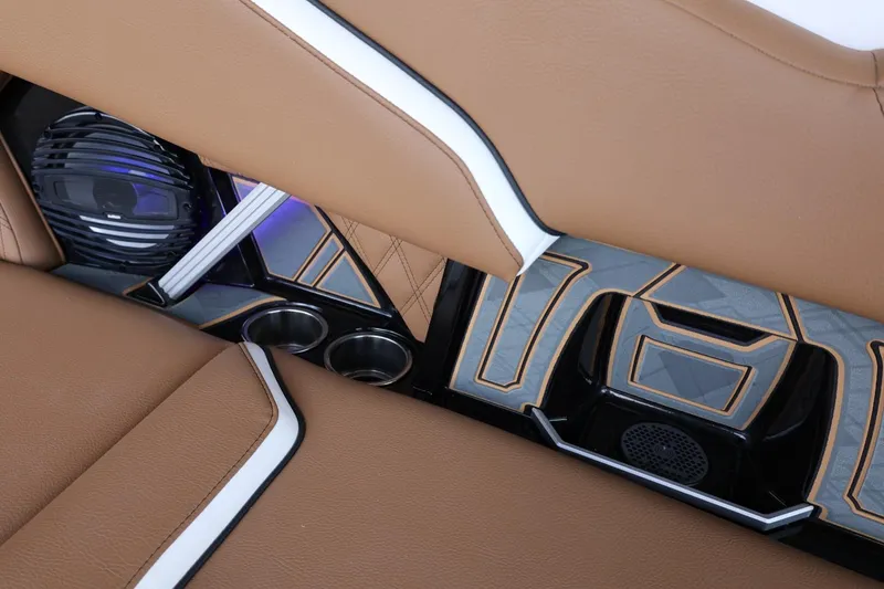 Slide: The Image of Luxurious interior of 2025 Tigé 24RZX boat with premium brown seating and modern speaker system. - 39