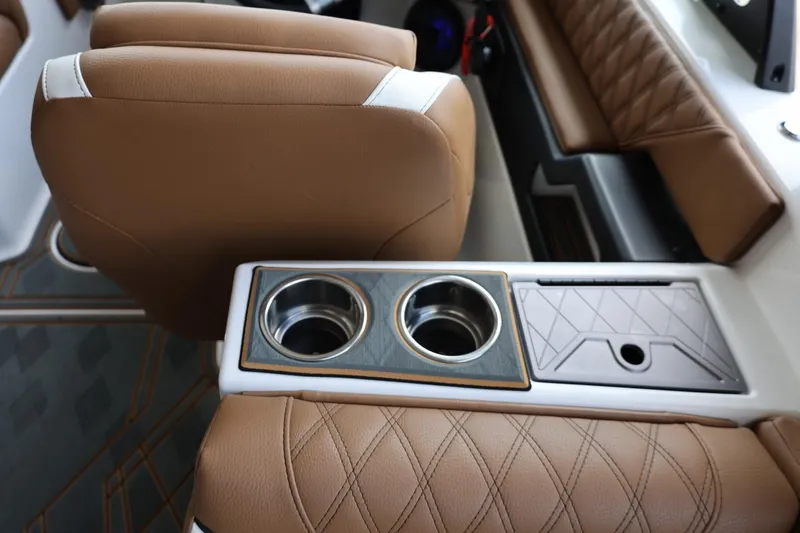 Slide: The Image of Luxurious interior of 2025 Tigé 24RZX boat with tan leather seats and cup holders. - 41