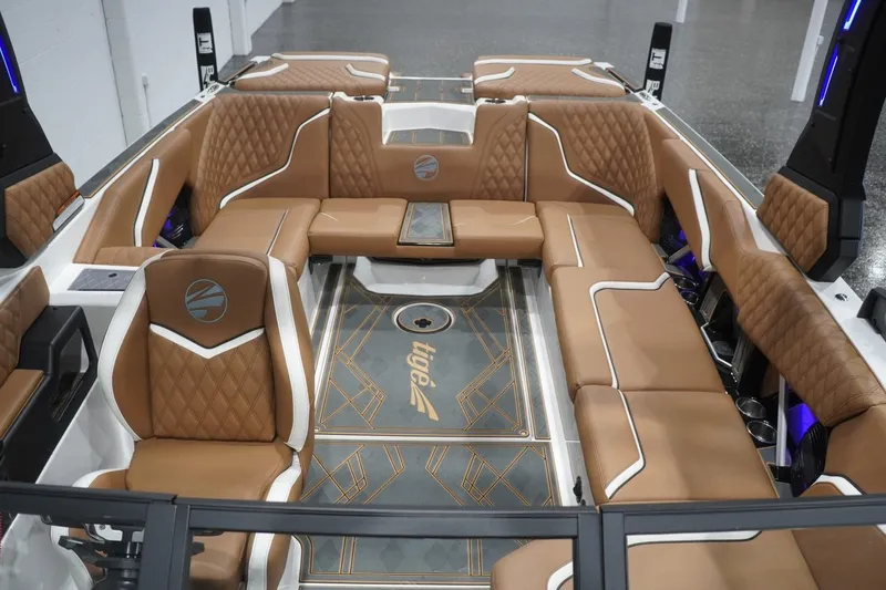 Slide: The Image of Luxurious interior of 2025 Tigé 24RZX boat with tan leather seating and modern design. - 60