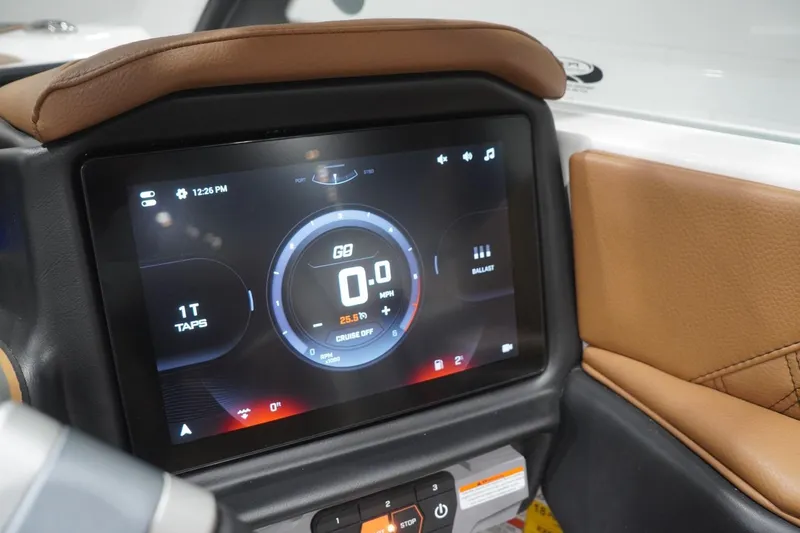 Slide: The Image of 2025 Tigé 24RZX dashboard with digital display and brown leather accents. - 65