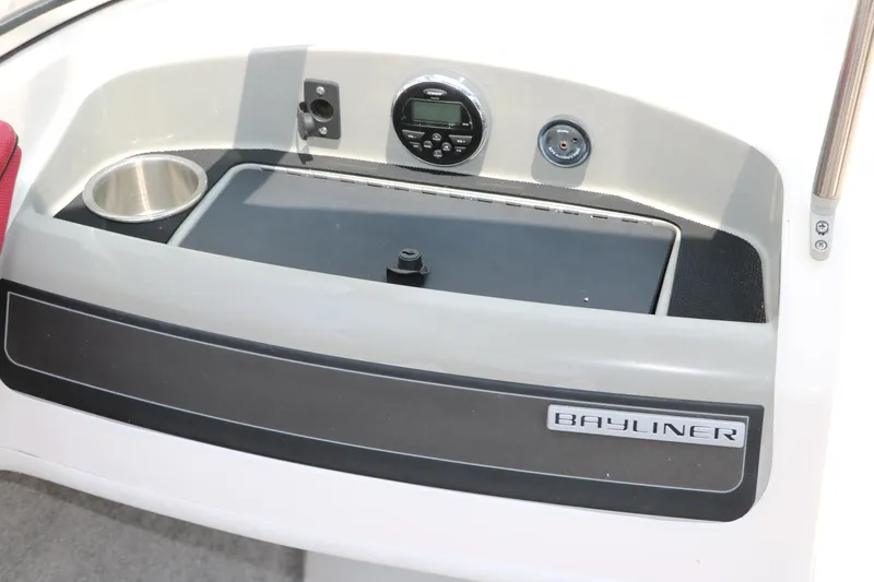 Slide: The Image of 2014 Bayliner 185 BR dashboard with cup holder and control panel. - 27
