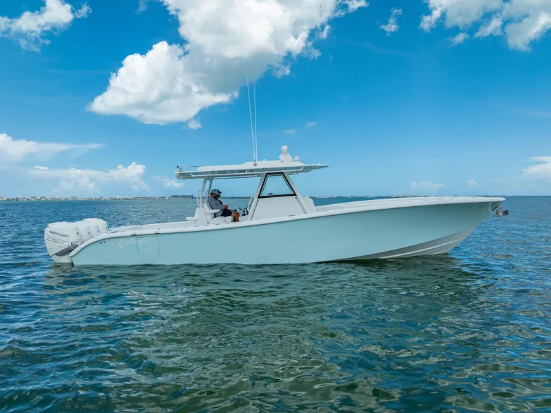 The Image of 2023 Yellowfin 39 Offshore boat on calm sea under blue sky. - 0