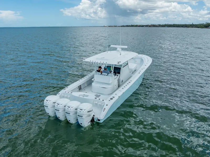 Slide: The Image of 2023 Yellowfin 39 Offshore boat with four engines cruising on open water. - 13
