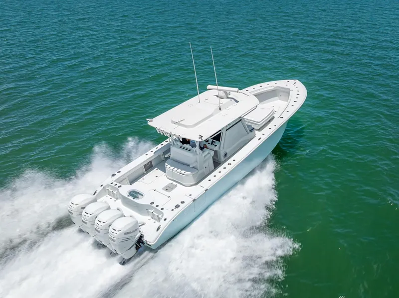 Slide: The Image of 2023 Yellowfin 39 Offshore boat cruising on open water, showcasing powerful engines. - 21