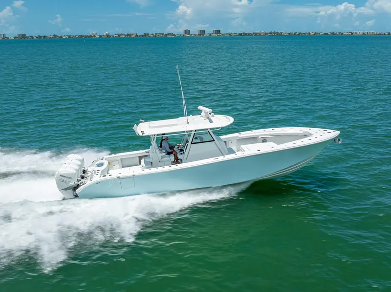 Slide: The Image of 2023 Yellowfin 39 Offshore boat cruising on open water, showcasing sleek design and performance. - 22