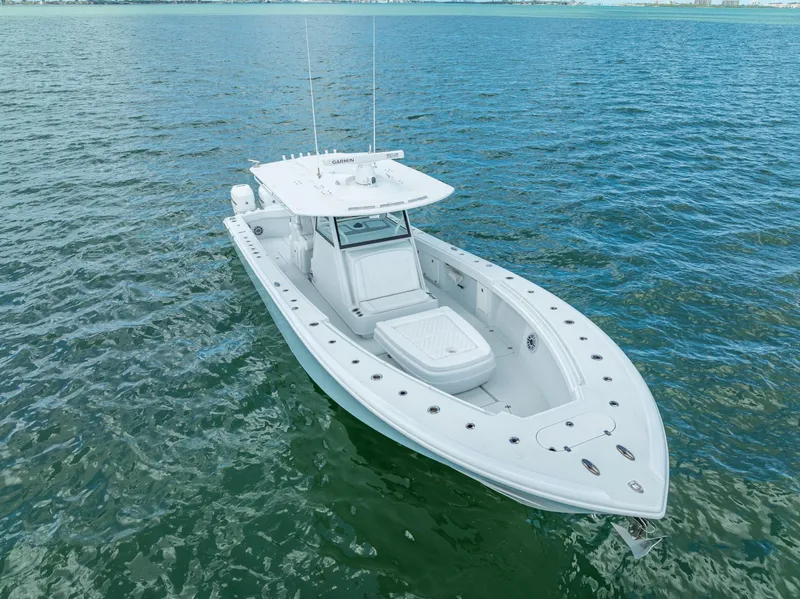 Slide: The Image of 2023 Yellowfin 39 Offshore boat on calm blue water. - 3