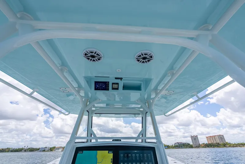 Slide: The Image of 2023 Yellowfin 39 Offshore boat interior with navigation equipment and speakers. - 34