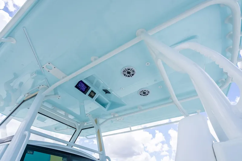 Slide: The Image of 2023 Yellowfin 39 Offshore boat's overhead console with speakers and electronics. - 37