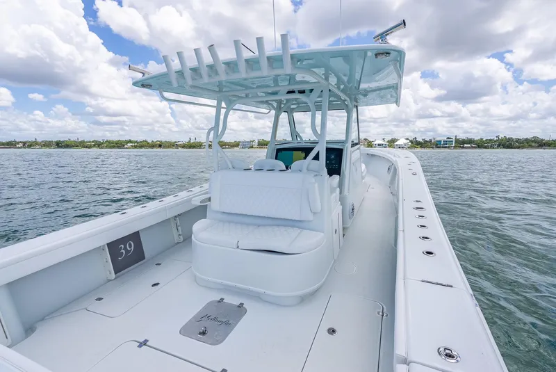 Slide: The Image of 2023 Yellowfin 39 Offshore boat on water, featuring spacious deck and modern design. - 39