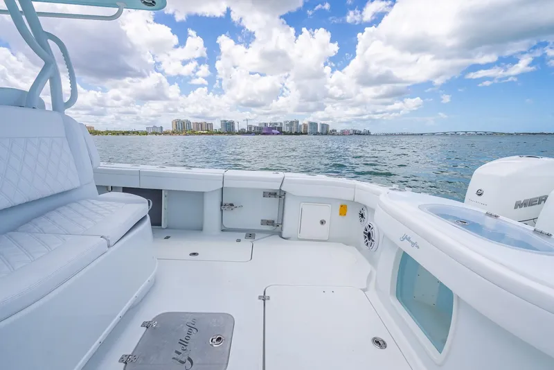 Slide: The Image of 2023 Yellowfin 39 Offshore boat interior with ocean view and city skyline. - 43