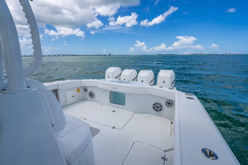 Slide: The Image of 2023 Yellowfin 39 Offshore boat on open water under a clear blue sky. - 46