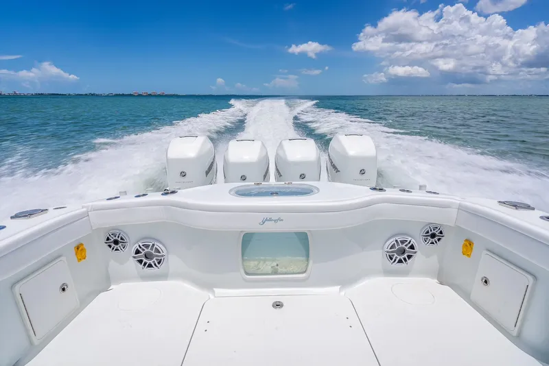 Slide: The Image of 2023 Yellowfin 39 Offshore boat cruising on open water, showcasing powerful engines. - 47