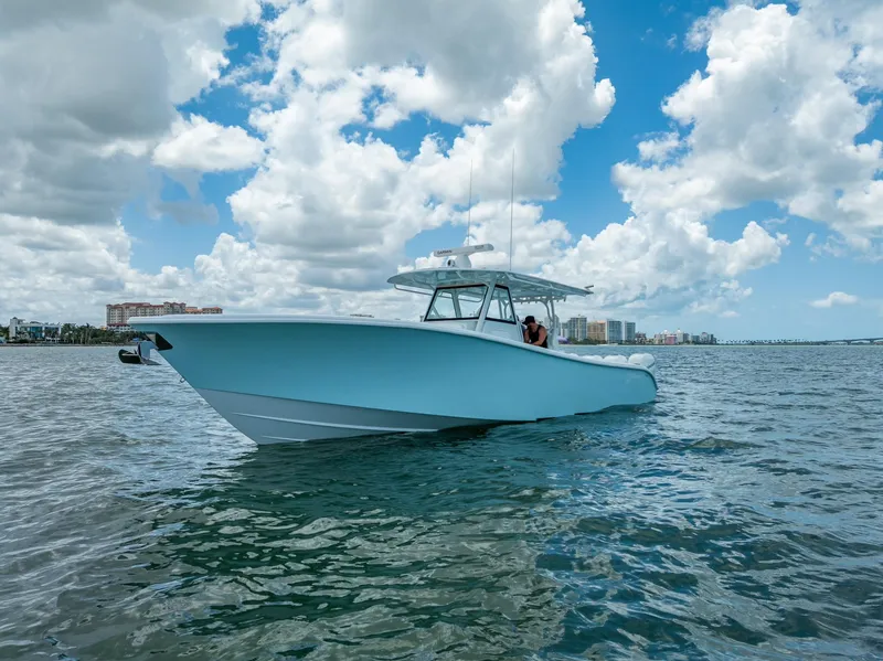 Slide: The Image of 2023 Yellowfin 39 Offshore boat on open water under a cloudy sky. - 6