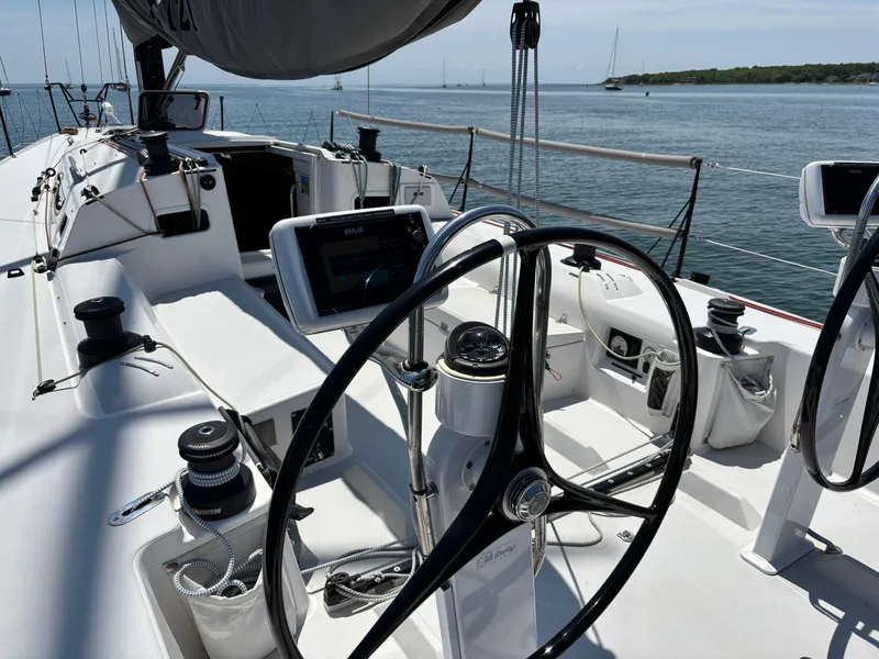 Slide: The Image of Cockpit of 2018 J Boats J/121 sailboat with steering wheel and navigation equipment. - 18