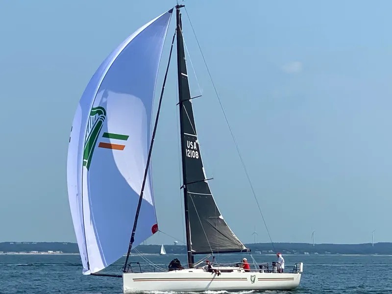 Slide: The Image of 2018 J Boats J/121 sailing with spinnaker on open water. - 2