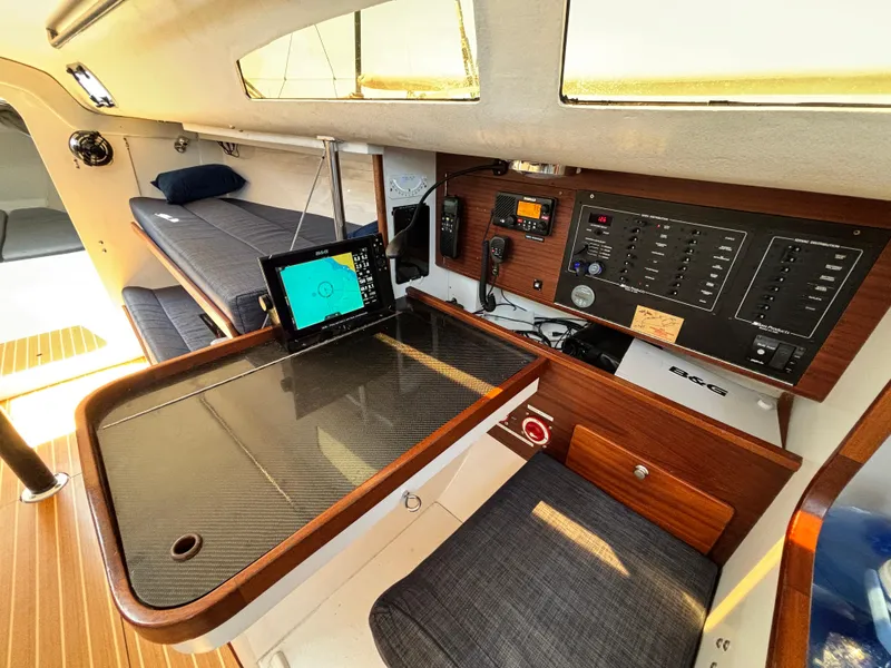 Slide: The Image of 2018 J Boats J/121 interior with navigation station, control panel, and seating area. - 23