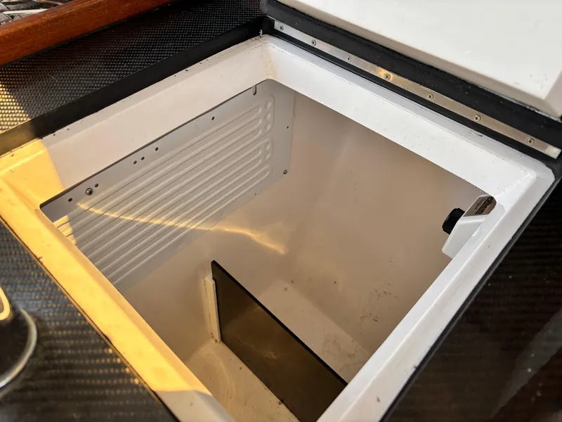 Slide: The Image of Open storage compartment on a 2018 J Boats J/121 sailboat. - 27