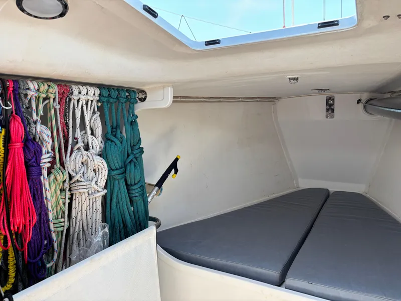Slide: The Image of Interior of 2018 J Boats J/121 sailboat with ropes and cushions. - 29