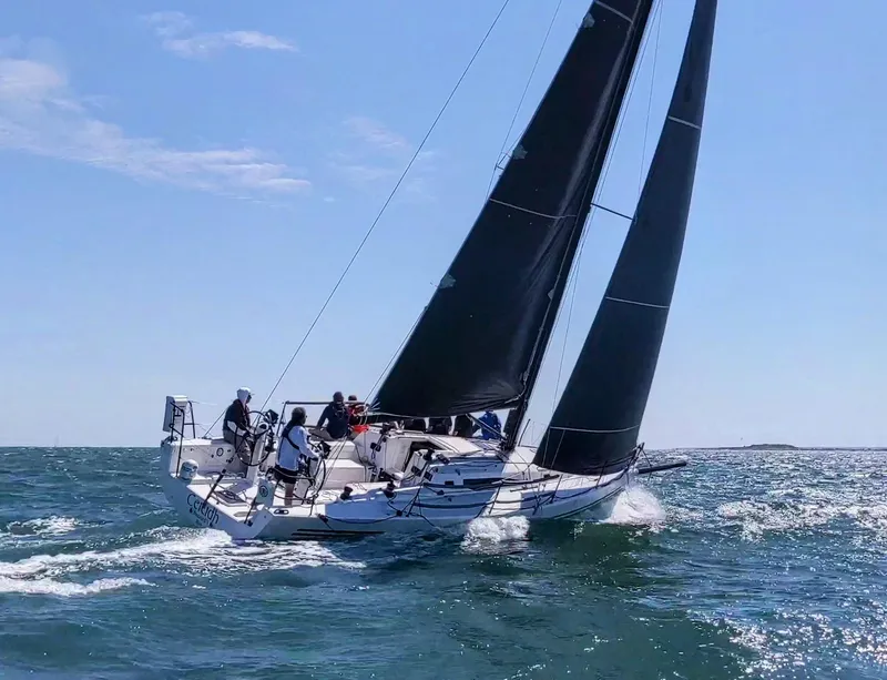 Slide: The Image of 2018 J Boats J/121 sailing on open water with crew. - 3
