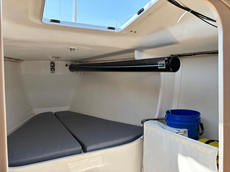 Slide: The Image of Interior cabin of 2018 J Boats J/121 sailboat with cushions and storage. - 30