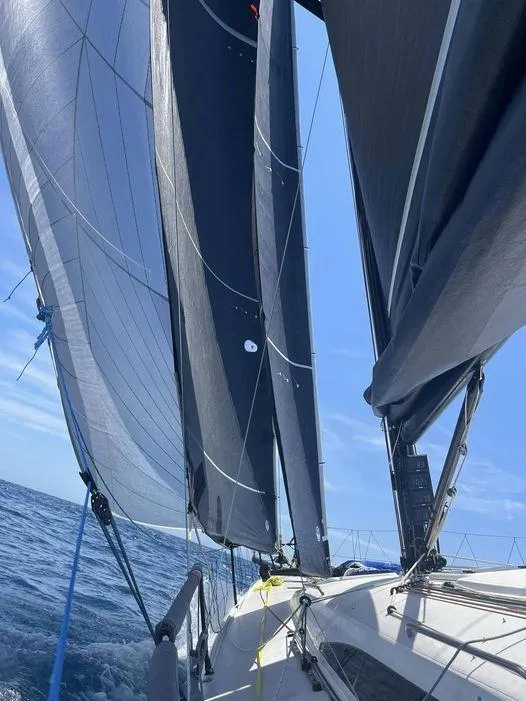 Slide: The Image of Sailing on a 2018 J Boats J/121 with full sails under a clear blue sky. - 4