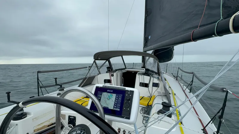Slide: The Image of 2018 J Boats J/121 sailboat cockpit with navigation equipment on open sea. - 7