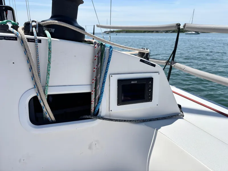 Slide: The Image of 2018 J Boats J/121 sailboat cockpit with ropes and navigation equipment. - 9