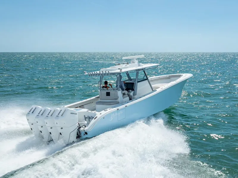 Slide: The Image of 2024 Yellowfin 39 boat cruising on open ocean waters. - 17