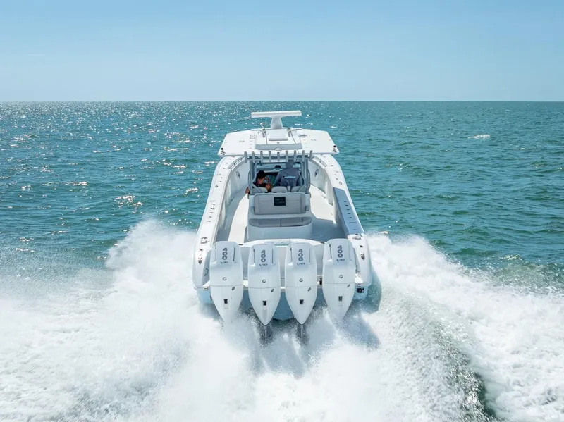 Slide: The Image of 2024 Yellowfin 39 boat cruising on open sea with powerful engines. - 18